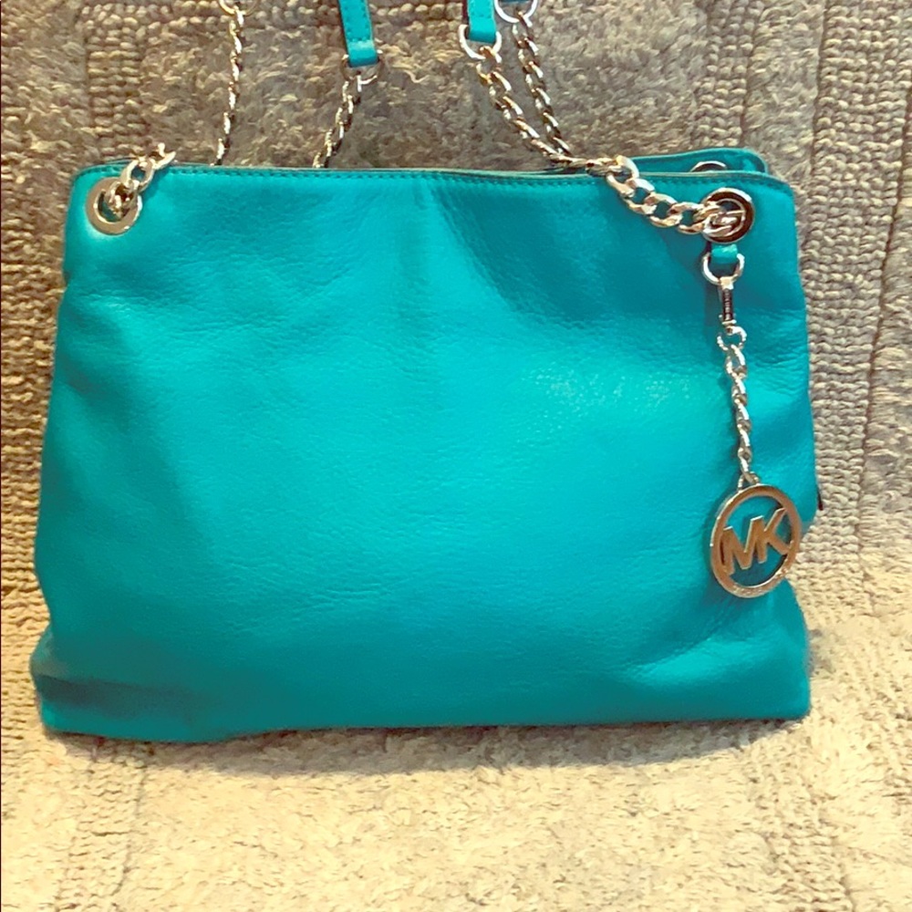 Michael Kors turquoise handbag.